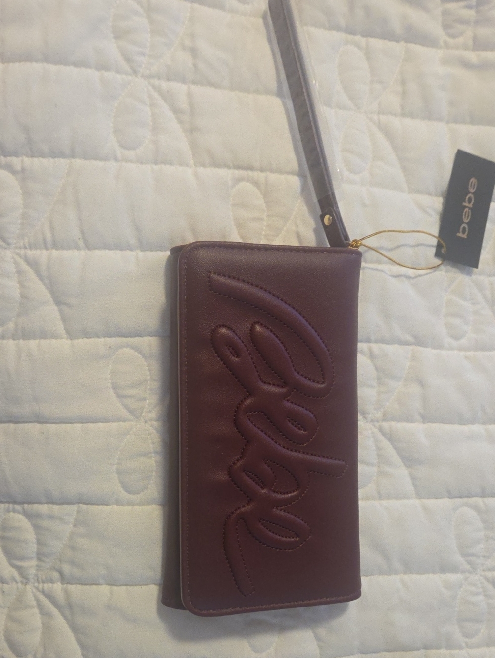 bebe Plum Embossed Logo Wristlet